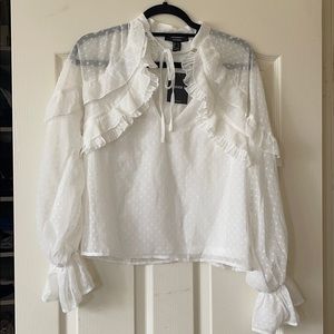 Polka dot blouse with ruffles